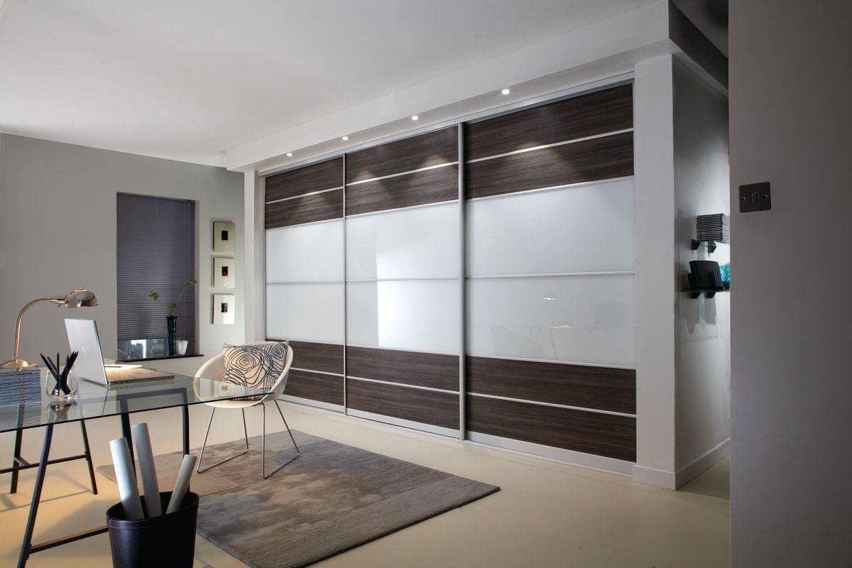 Volante Bedroom Modern study area with built in wardrobe with dark wooden & glass sliding doors